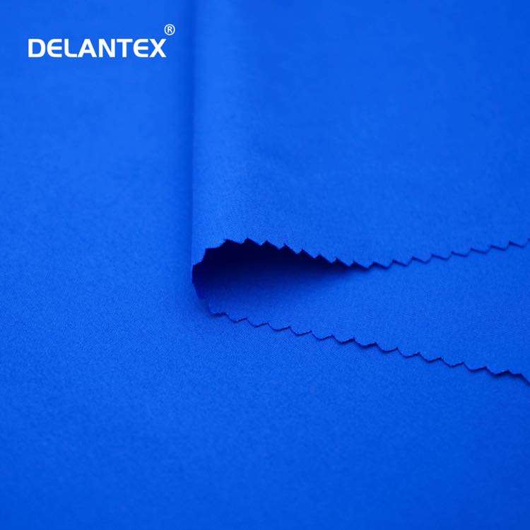Delantex Wholesale 100 Polyester Soft Drape Peach Skin Microfiber Fabric for Garment