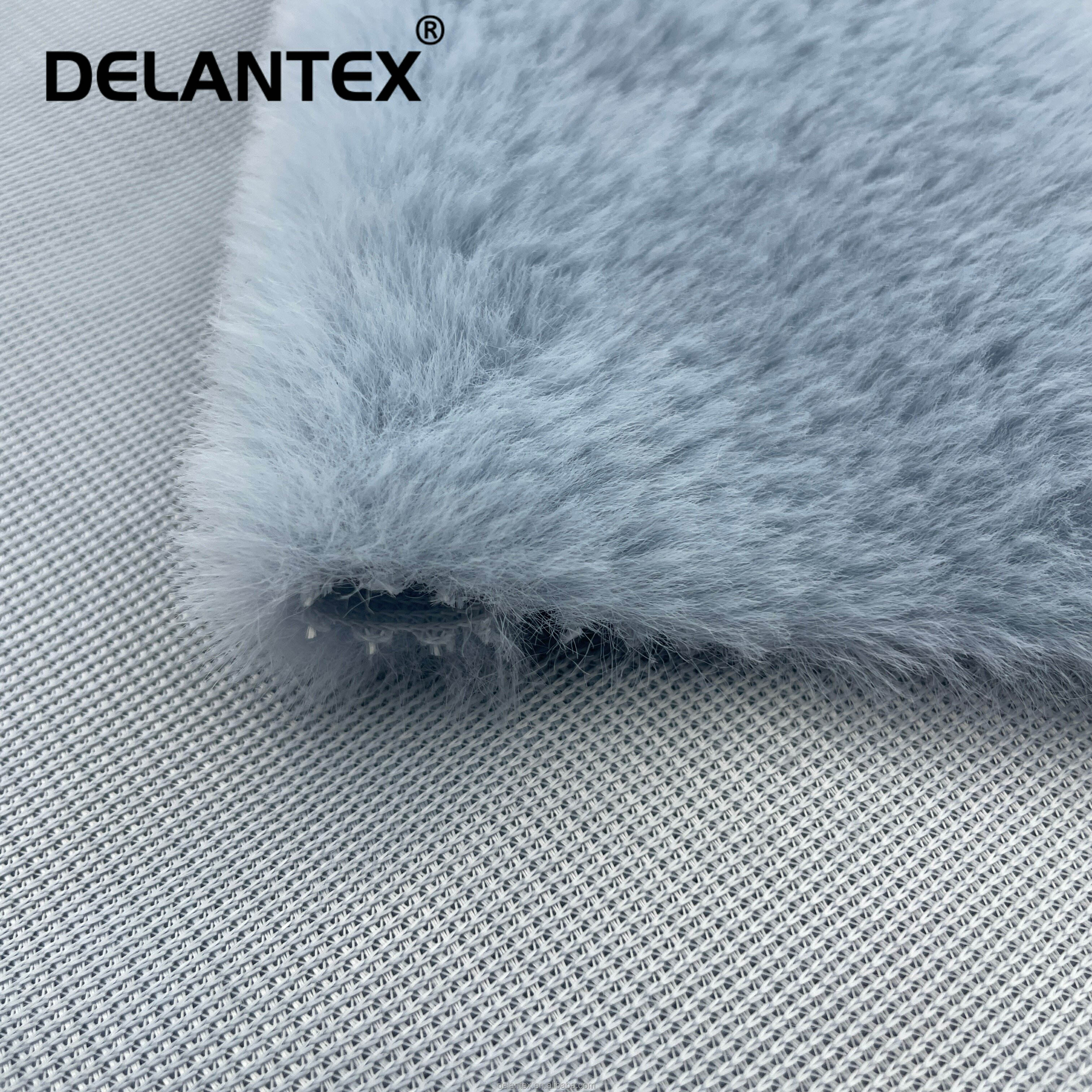 Delantex Customized Colors Soft High Quality Keeping Warm Polyester Rabbit Fur Fabric Wholesaler