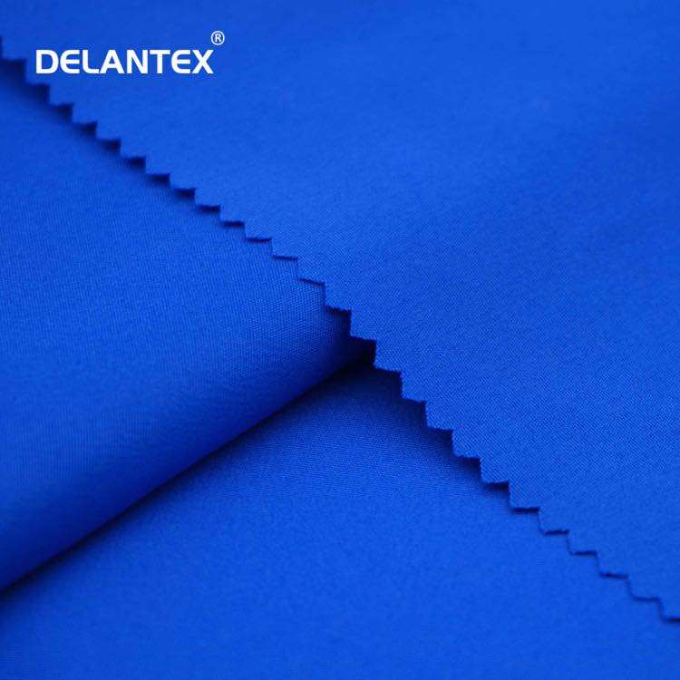 Delantex Wholesale 100 Polyester Soft Drape Peach Skin Microfiber Fabric for Garment