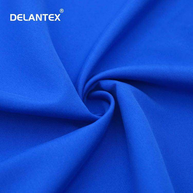 Delantex Wholesale 100 Polyester Soft Drape Peach Skin Microfiber Fabric for Garment